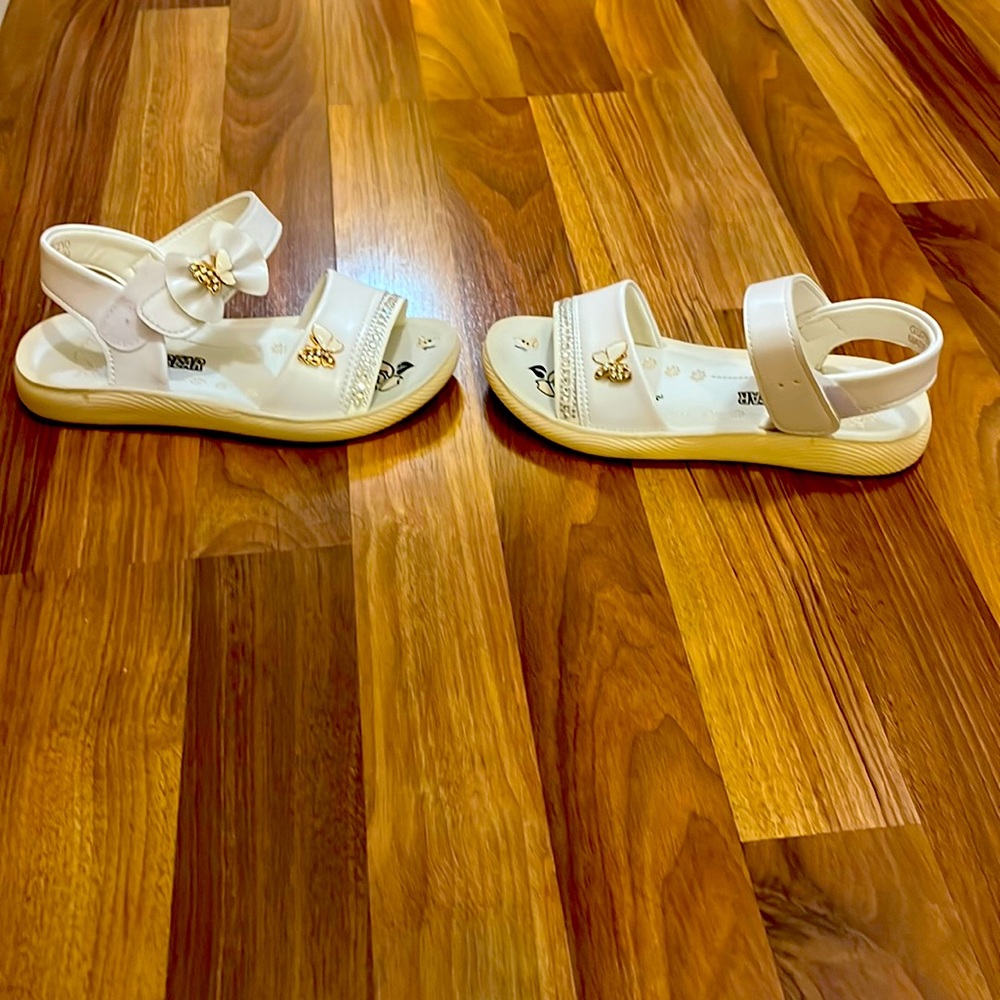 Butterfly charm sandals.